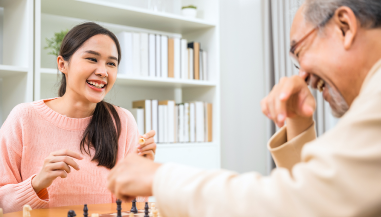 A man and a woman are playing a game of chess.