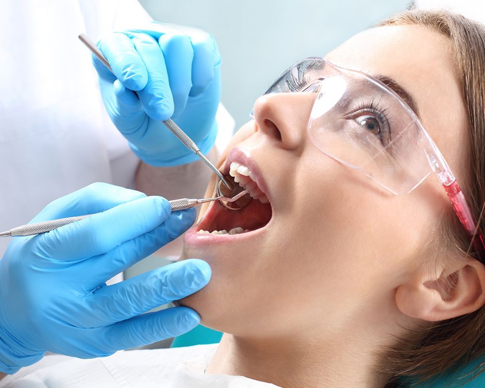 Specialist from Highland Family Dental providing dental services to a patient in Bend, OR