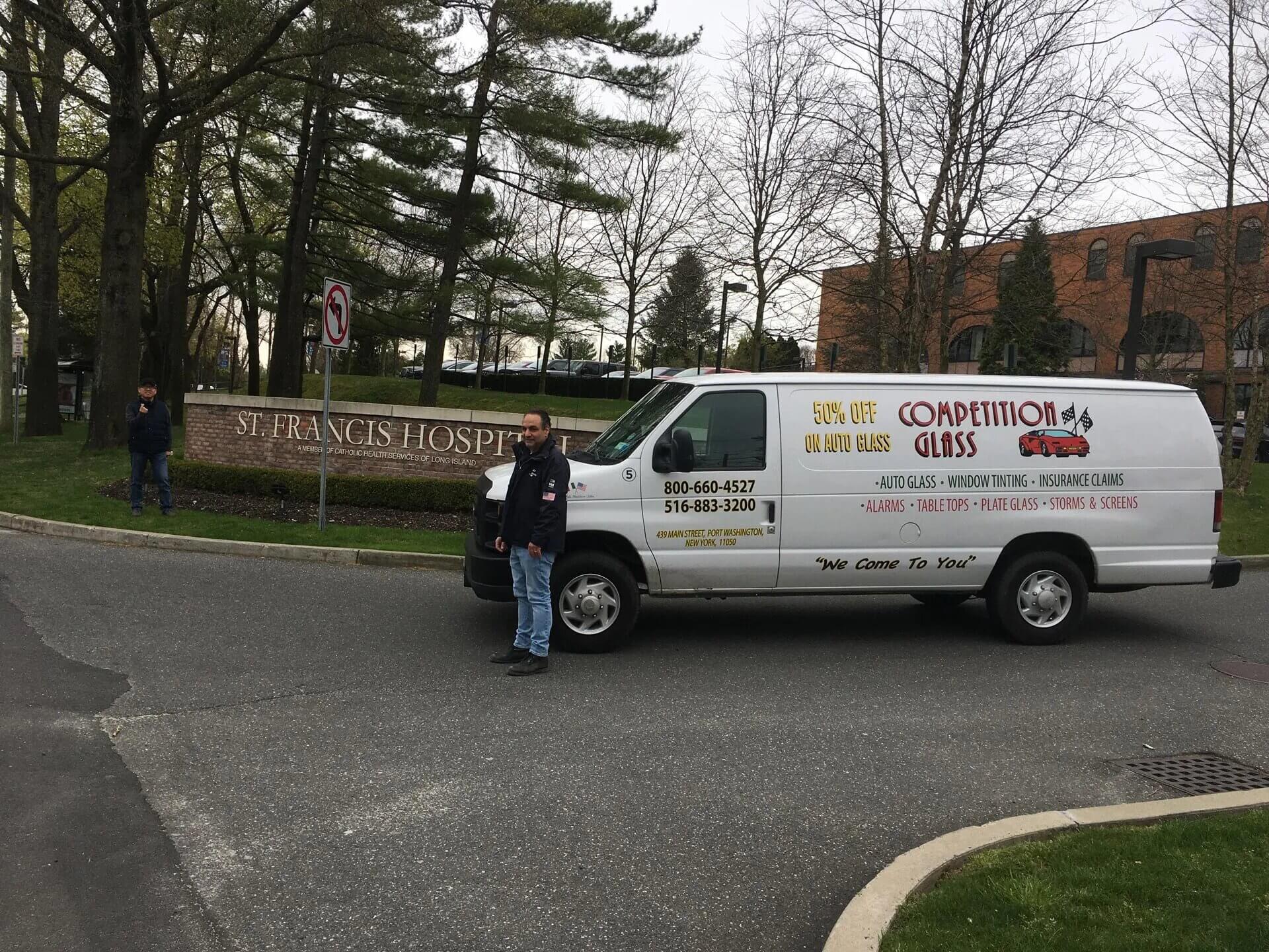 Man Standing Beside the Company Van — Port Washington, NY — Competition Glass Inc