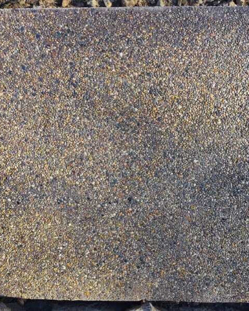 A close up of a piece of gravel on the ground.