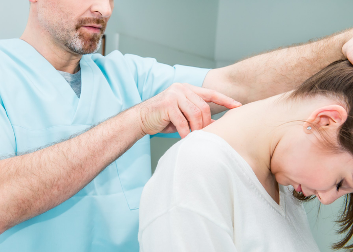 Doctor checking Neck of Patient