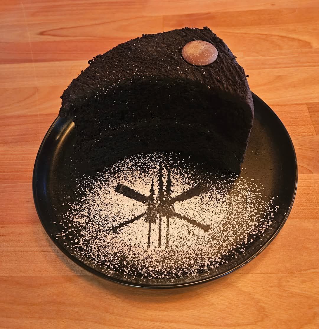 cake on a black plate 1