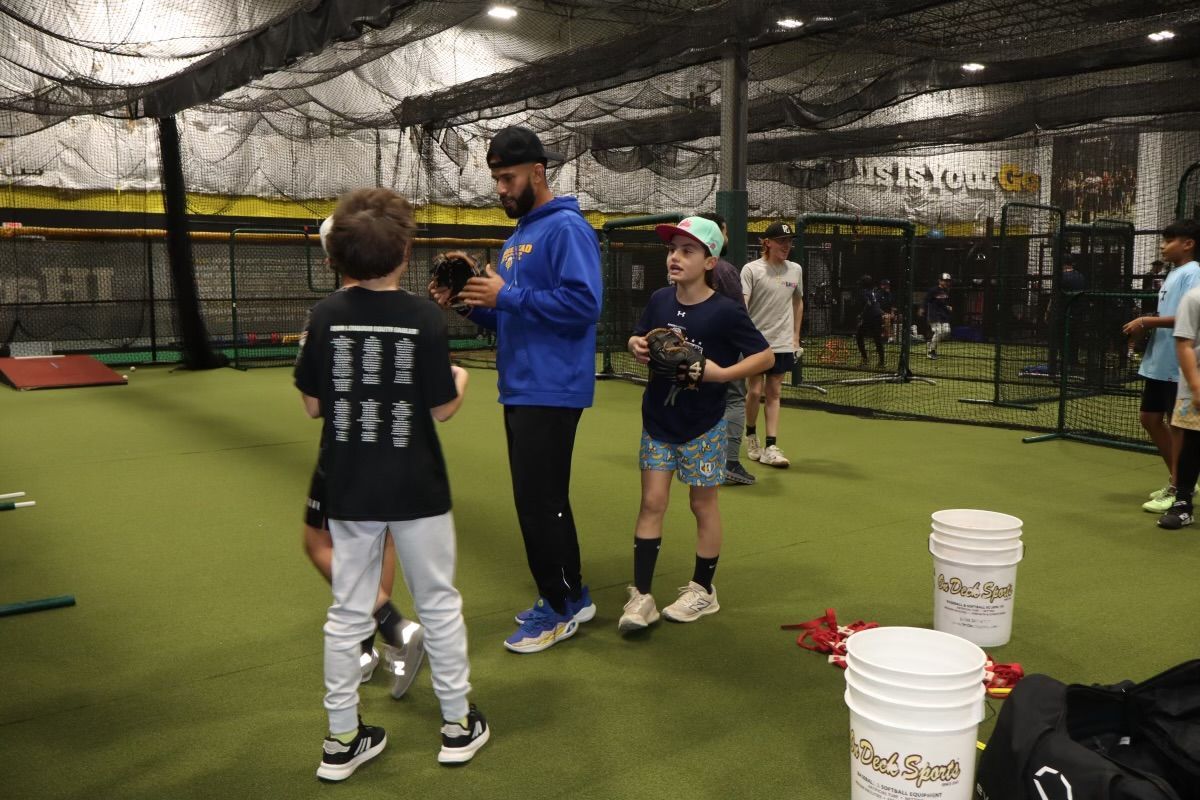 A baseball player with the number 4 on the back of his jersey