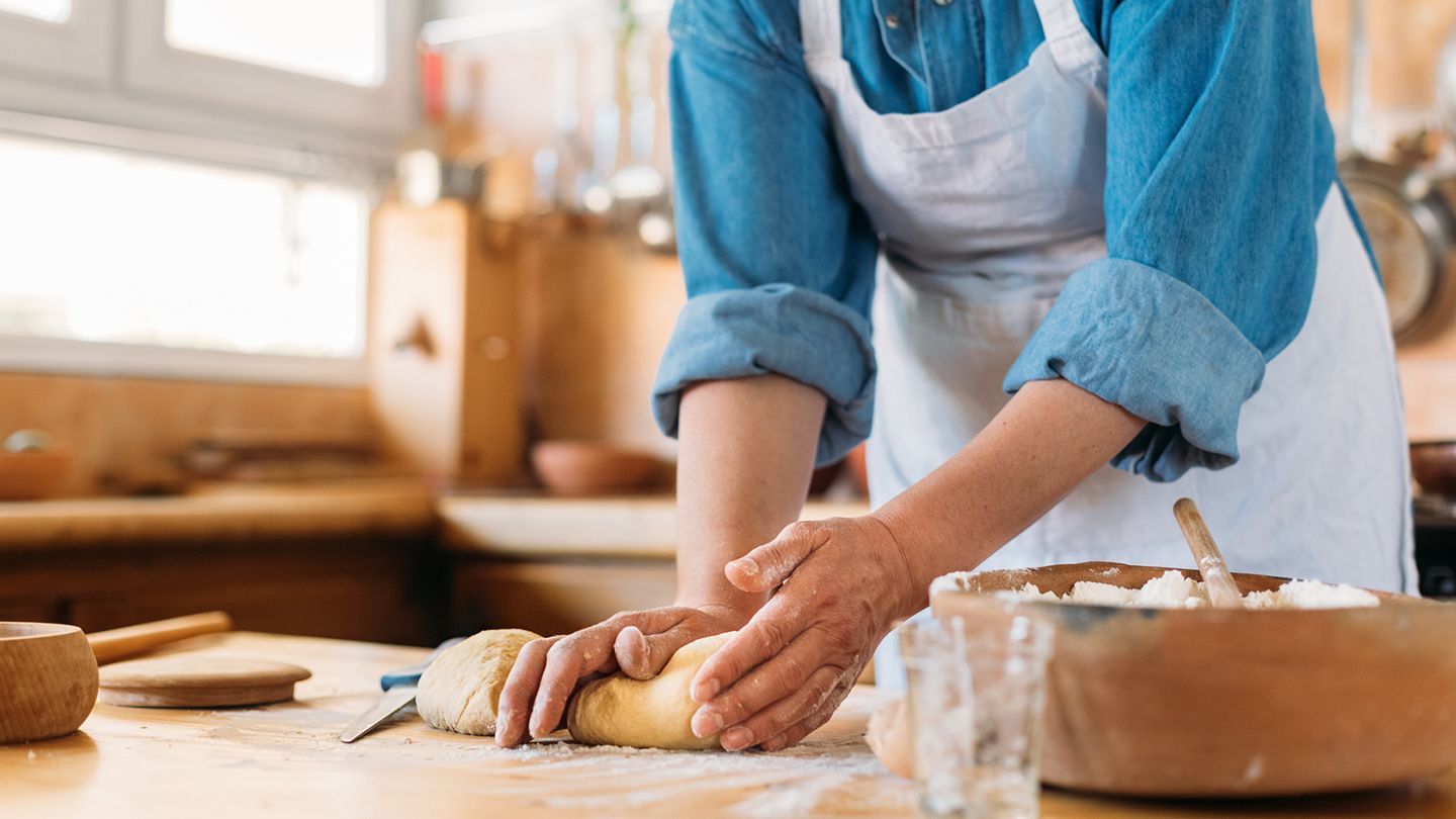 Person rolling dough on a countertop