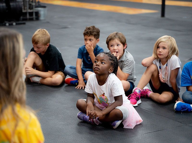 Kids listening to a coach at Gantry Kids in Long Island City