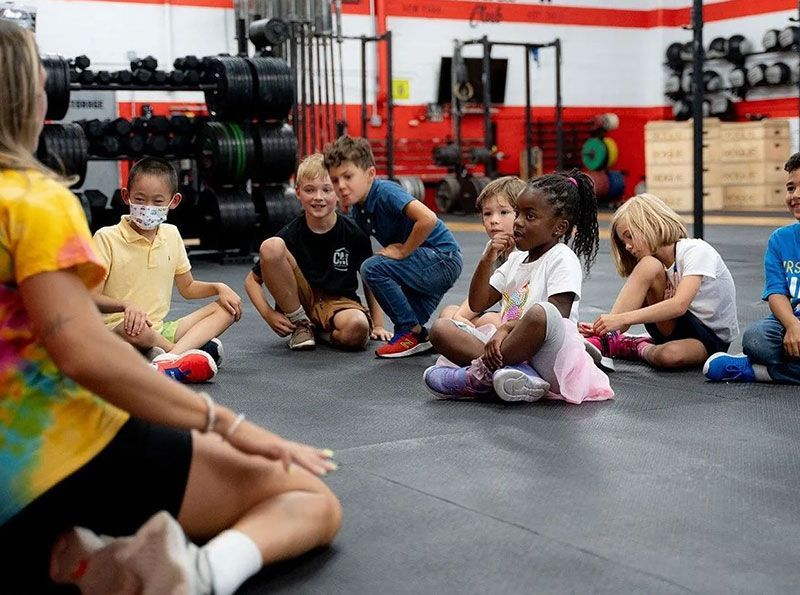 Kids sitting in a circle at Gantry Kids in Long Island City