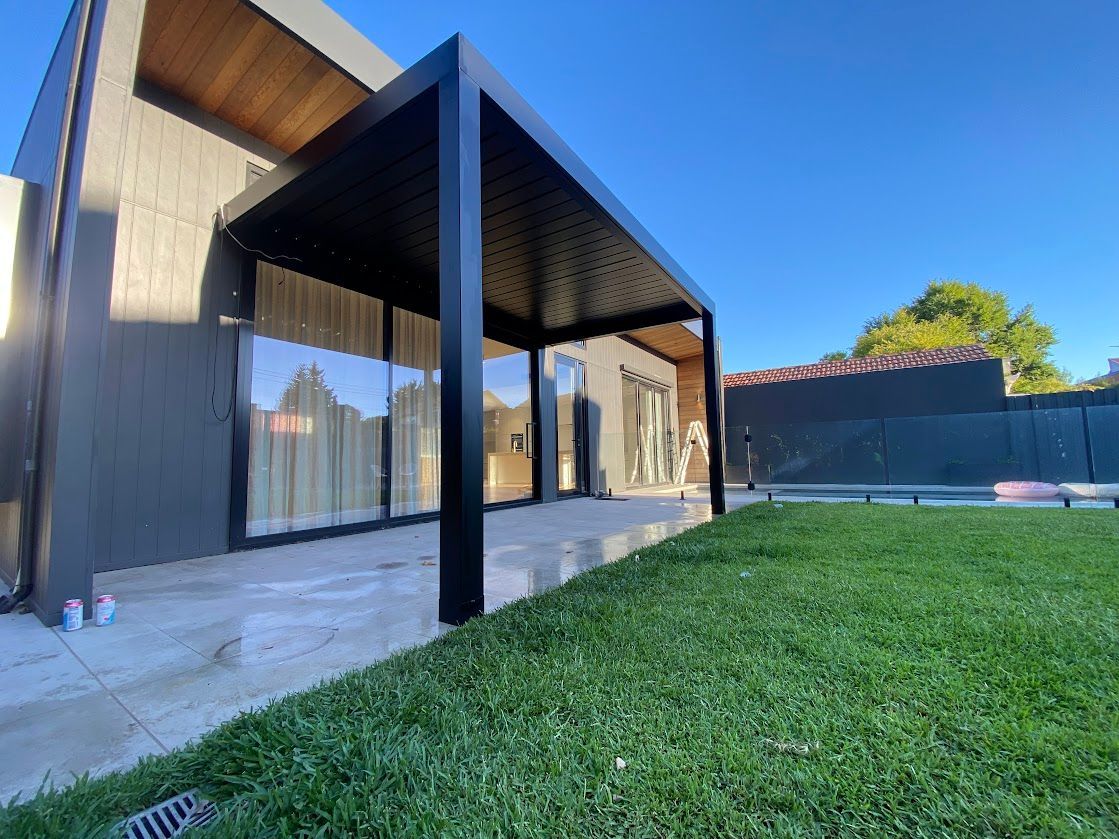 A Retractable Roof System Above A Patio  — Night & Day Blinds and Awnings in Pakenham, VIC