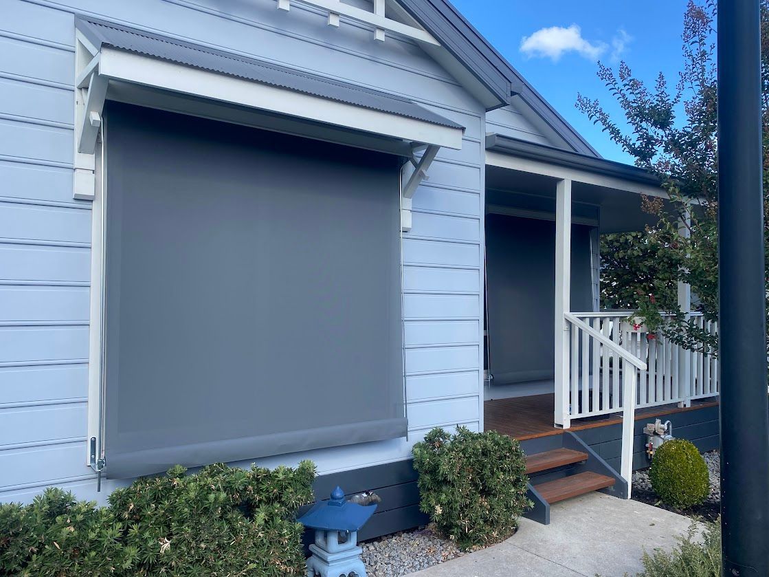 A Window With A Blind On It And A Picture Of A Field In The Background  — Night & Day Blinds and Awnings in Pakenham, VIC