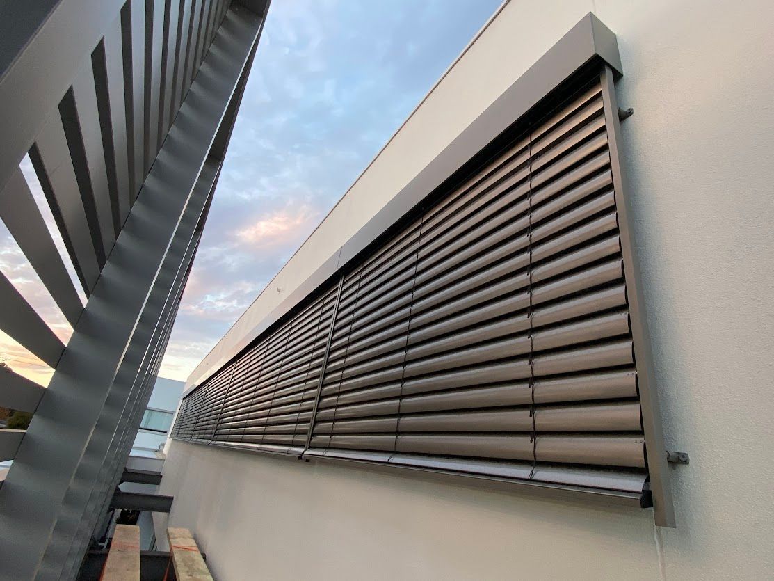 PVC blinds on the side of a White House — Night & Day Blinds and Awnings in Pakenham, VIC