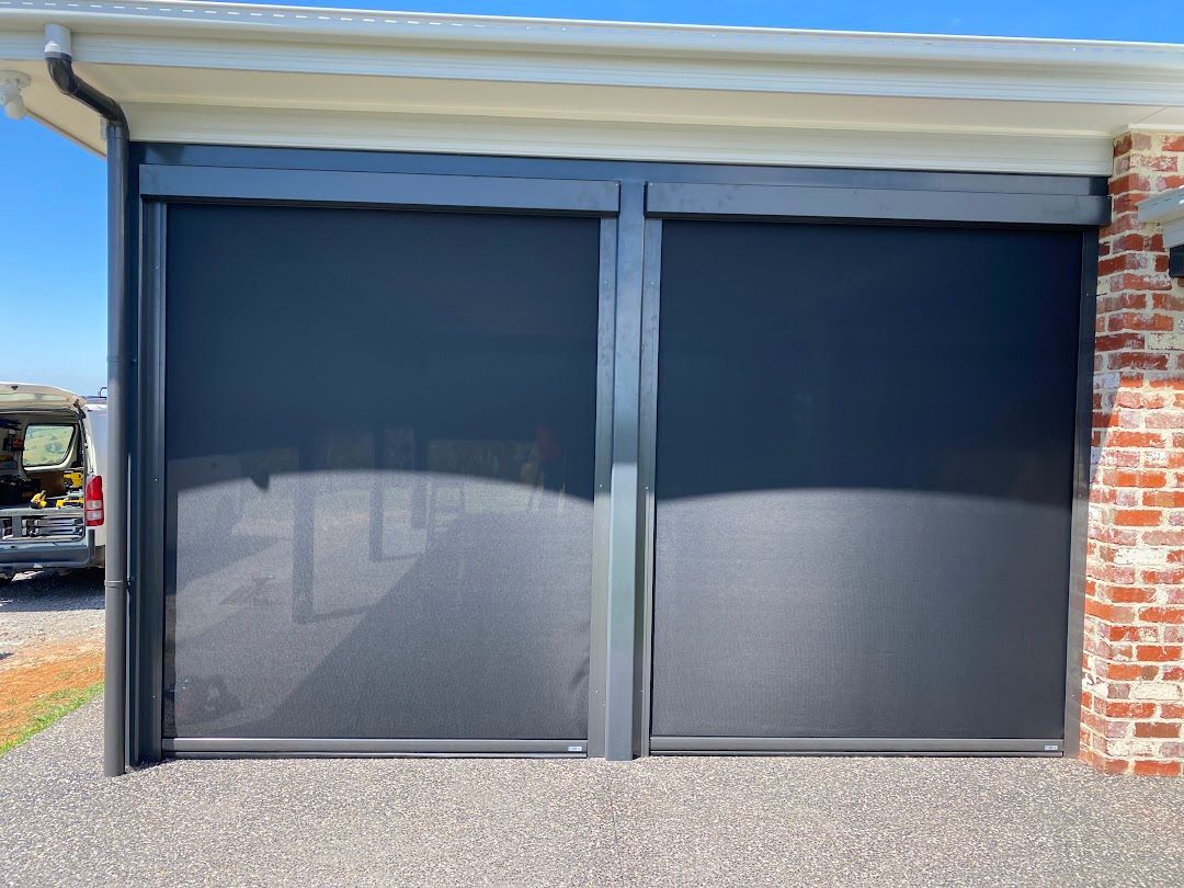 A House With A Black Ziptrack Blinds— Night & Day Blinds and Awnings in Pakenham, VIC