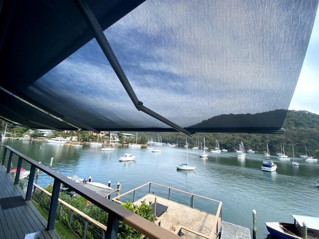 A Awning Over A Deck Looking Over The Ocean — Night & Day Blinds and Awnings in Pakenham, VIC
