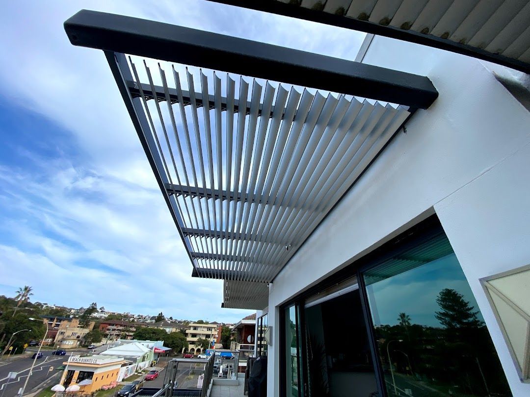 A Roof System off a White Building  — Night & Day Blinds and Awnings in Pakenham, VIC