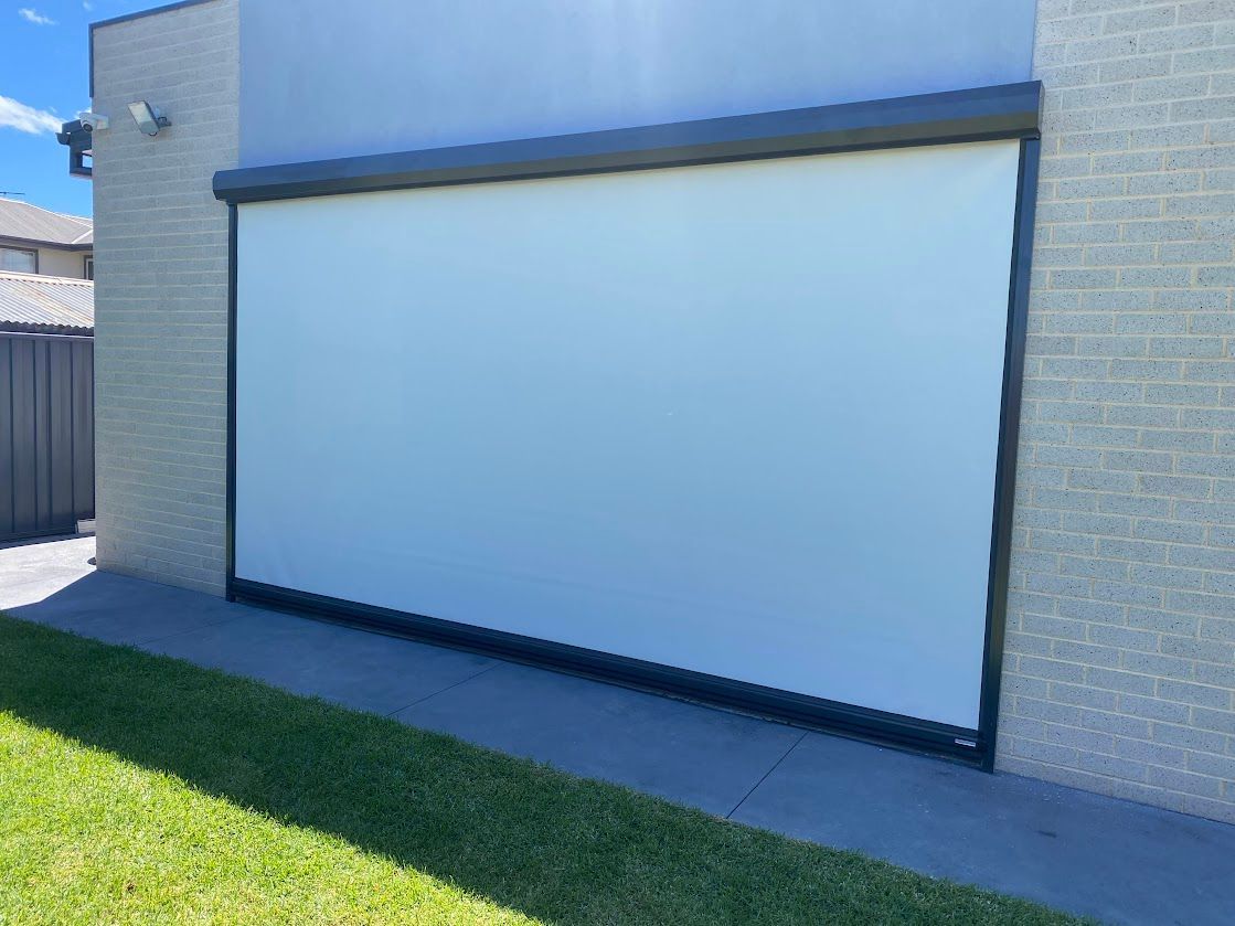 A Roll Down White Blind Outside   — Night & Day Blinds and Awnings in Pakenham, VIC