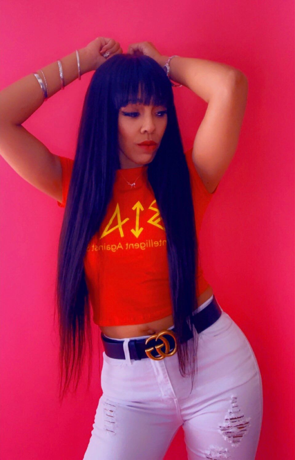 A woman wearing a red shirt that says a12 on it