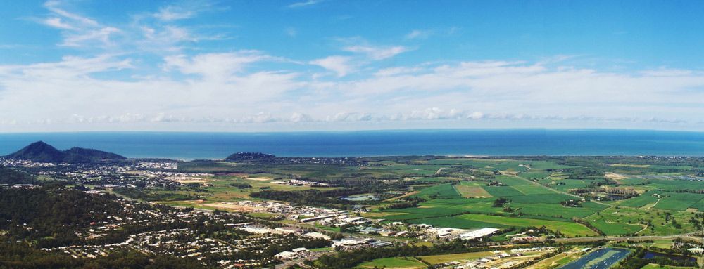An Aerial View Of A City And A River With The Ocean In The Background — Edmonton Car Air in Smithfield, QLD