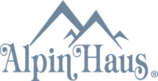 A logo for alpin haus with a mountain in the background