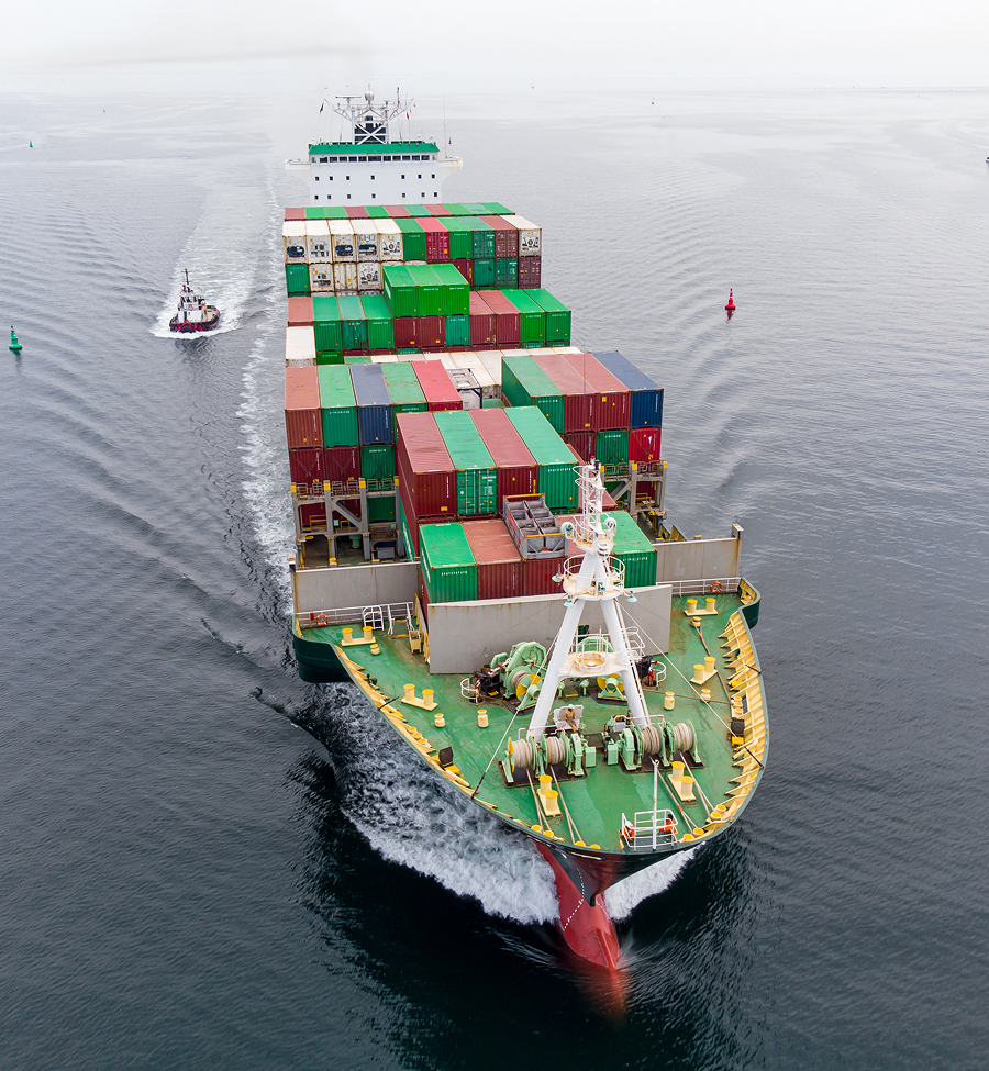 An aerial view of a large container ship in the ocean