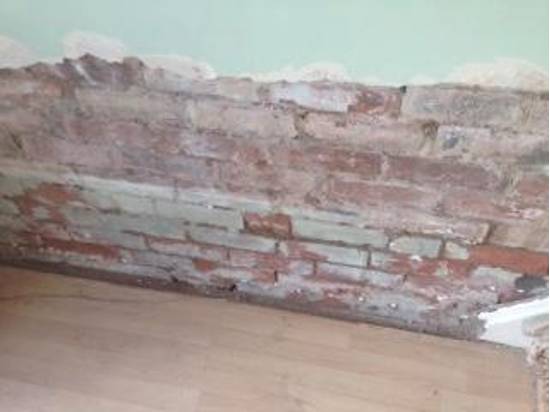 brickwork on a wall effected by damp