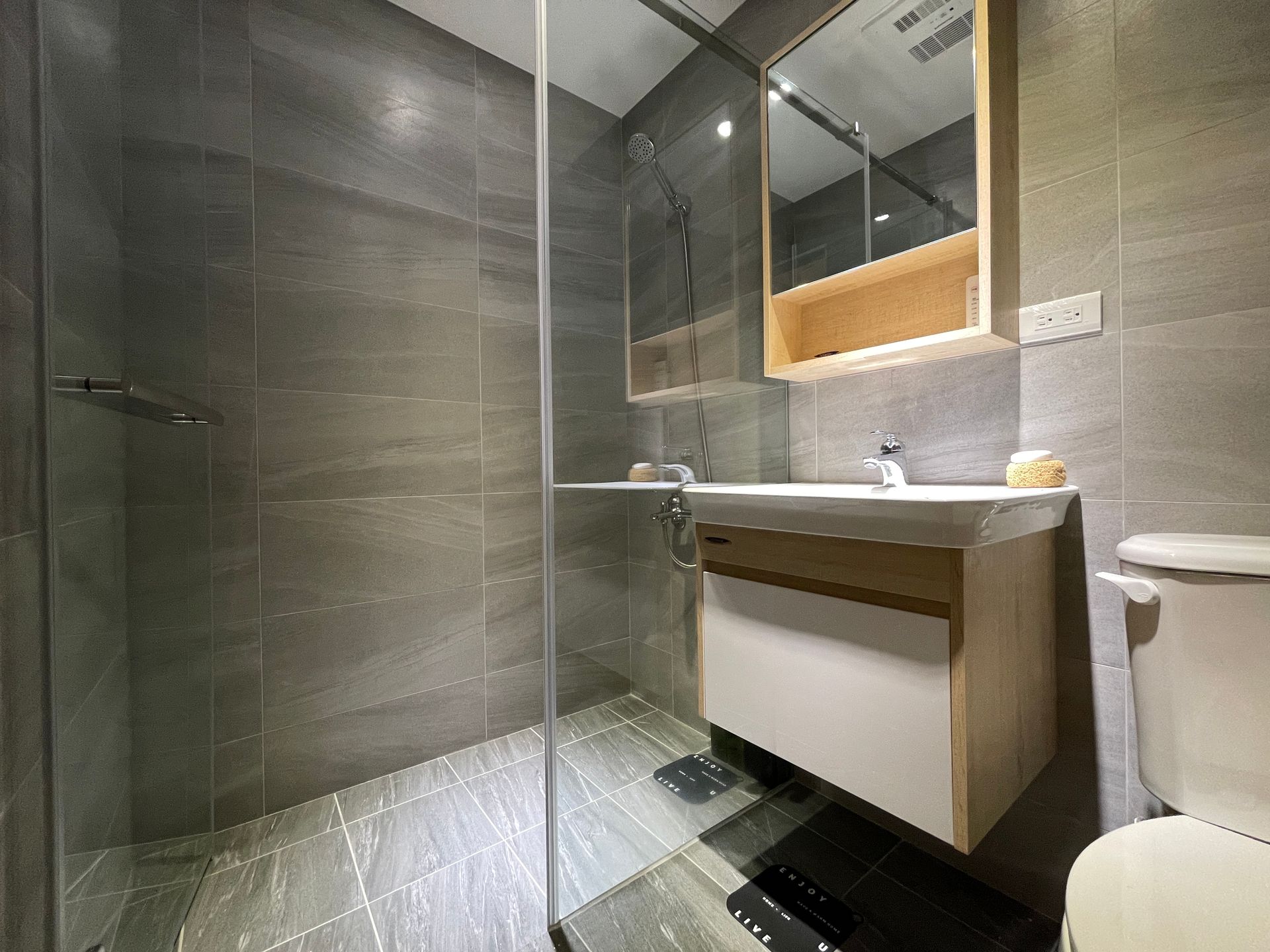 A living room with a couch a table and a television