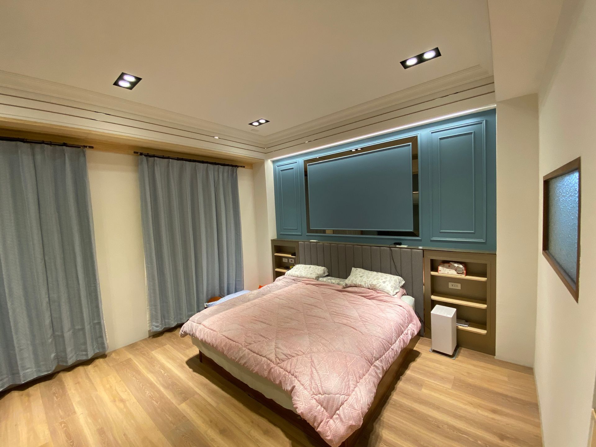 There is a large bed in the middle of the room.