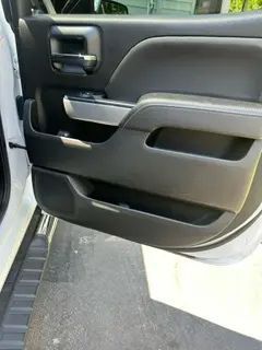 A close up of a car door with the door open.