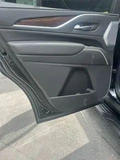 A close up of a car door with the door open.