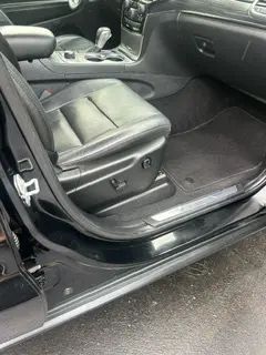 The inside of a black jeep grand cherokee with the door open.