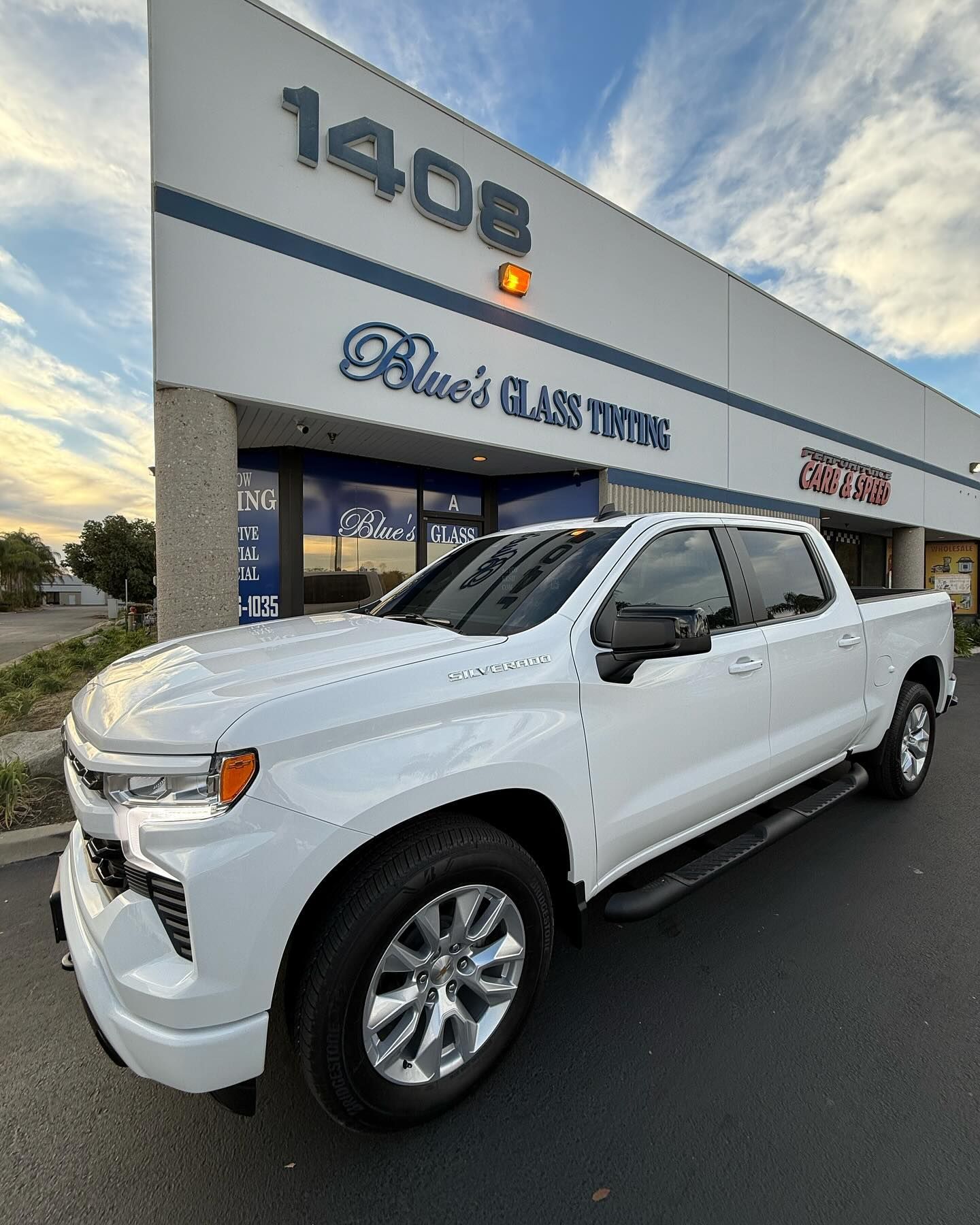White Chevrolet pickup truck parked in front of