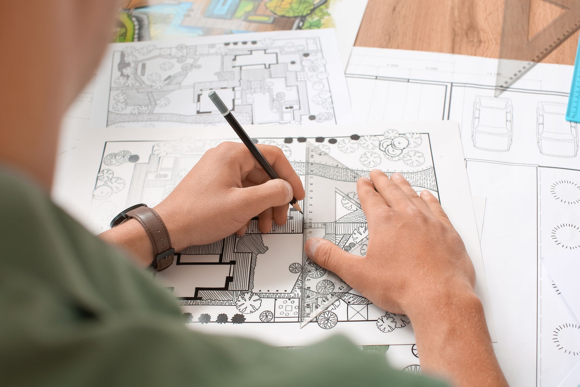 A man is drawing a landscape. A man is drawing a landscape.