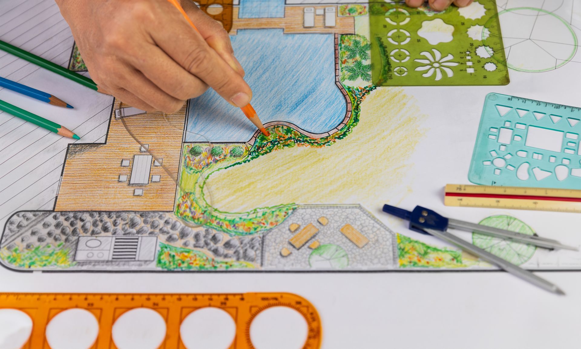 A landscape architect is doing a garden plan design by hand drawing.