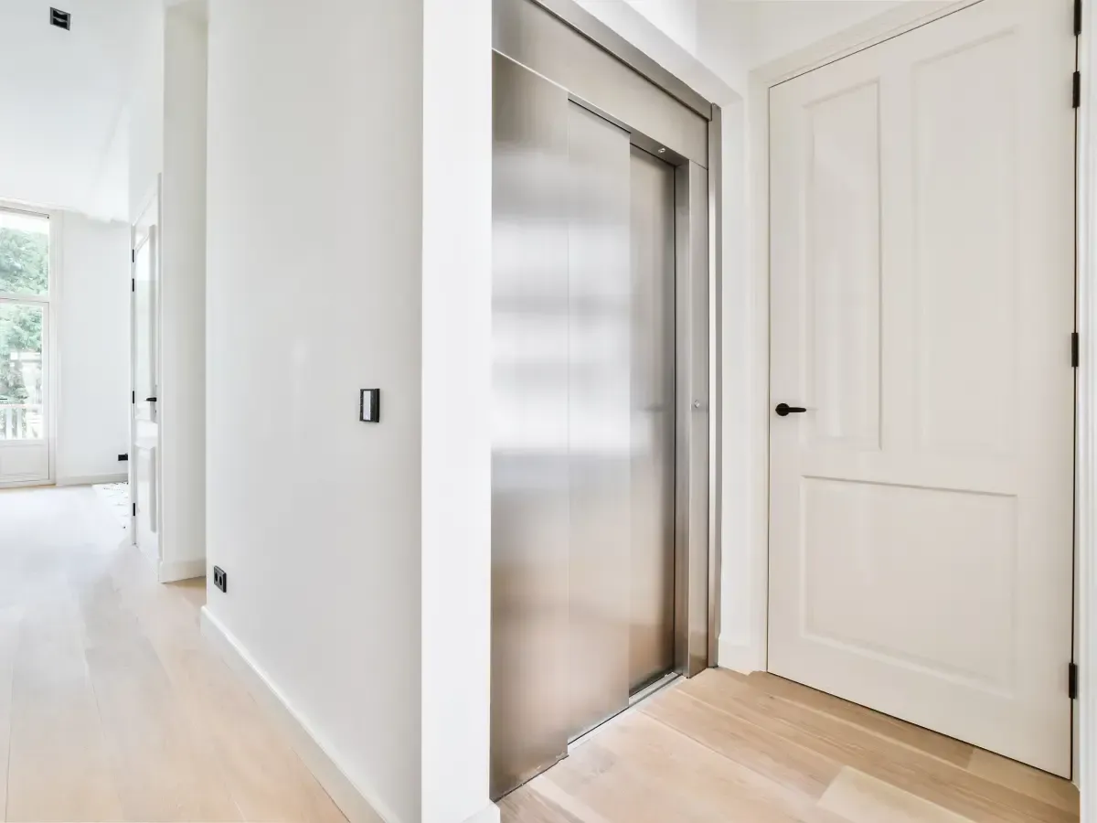 residential elevator installed inside modern home hallway