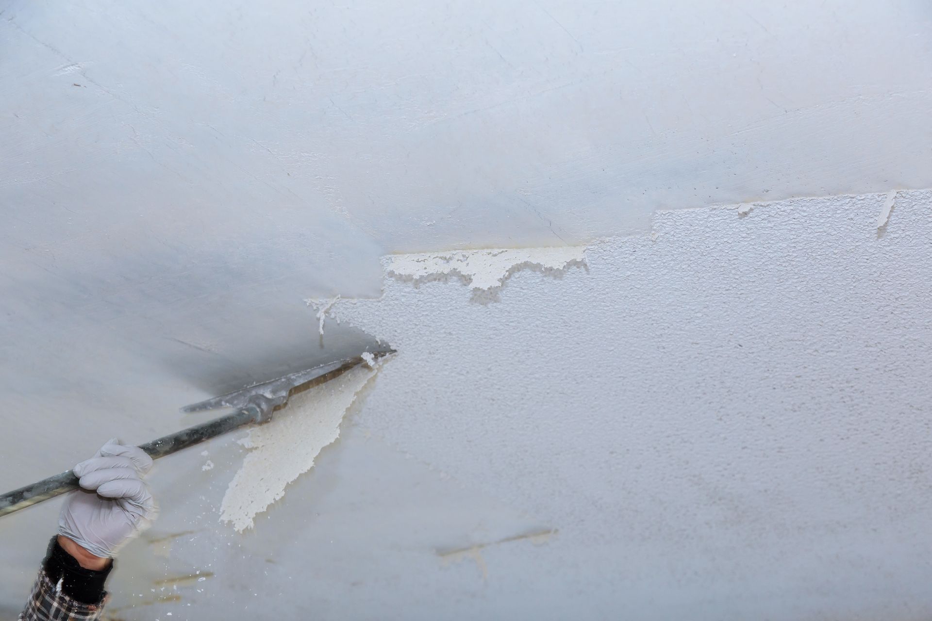Popcorn ceiling removal is a job that is tedious and should be done with care. 