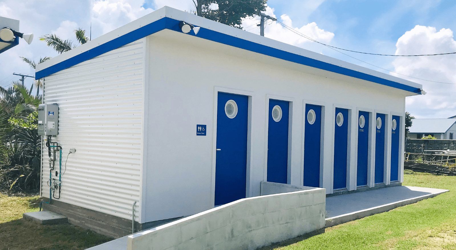 A white building with blue doors and a ramp — Integrabuild in Bowen, QLD