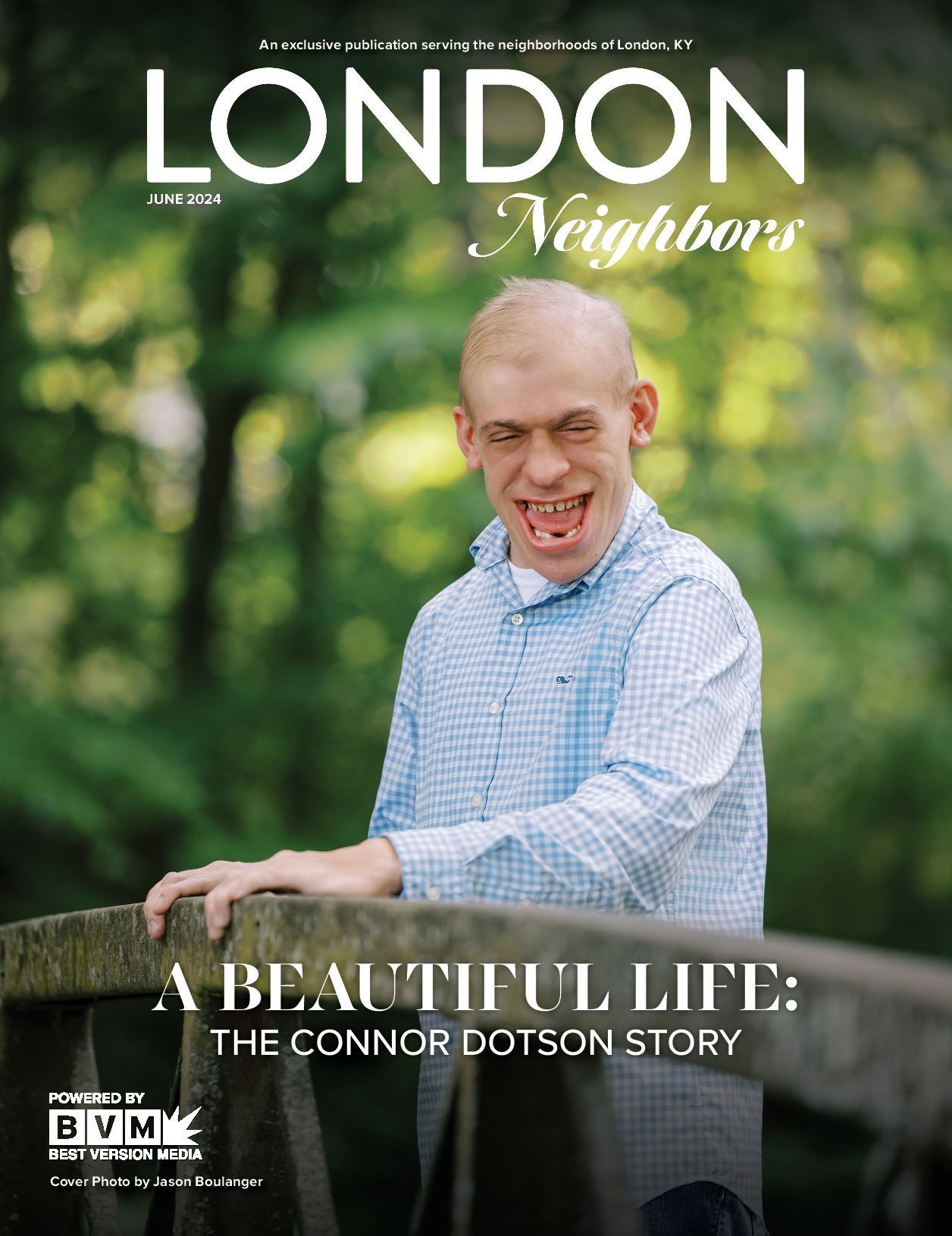 Magazine cover: Man smiling, light blue shirt, outside, title 