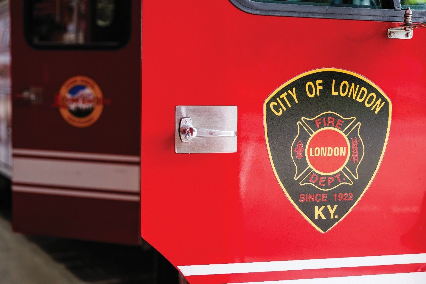 Red fire truck with City of London Fire Dept. badge, since 1929, KY.