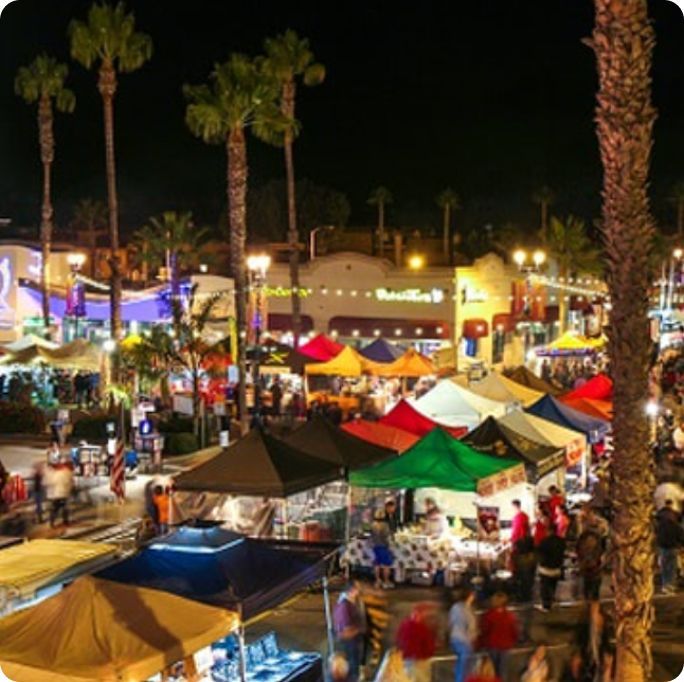 A crowd of people are gathered at a night market