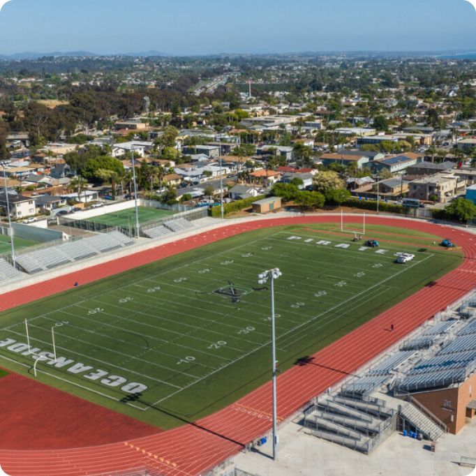 An aerial view of an oceanside football field