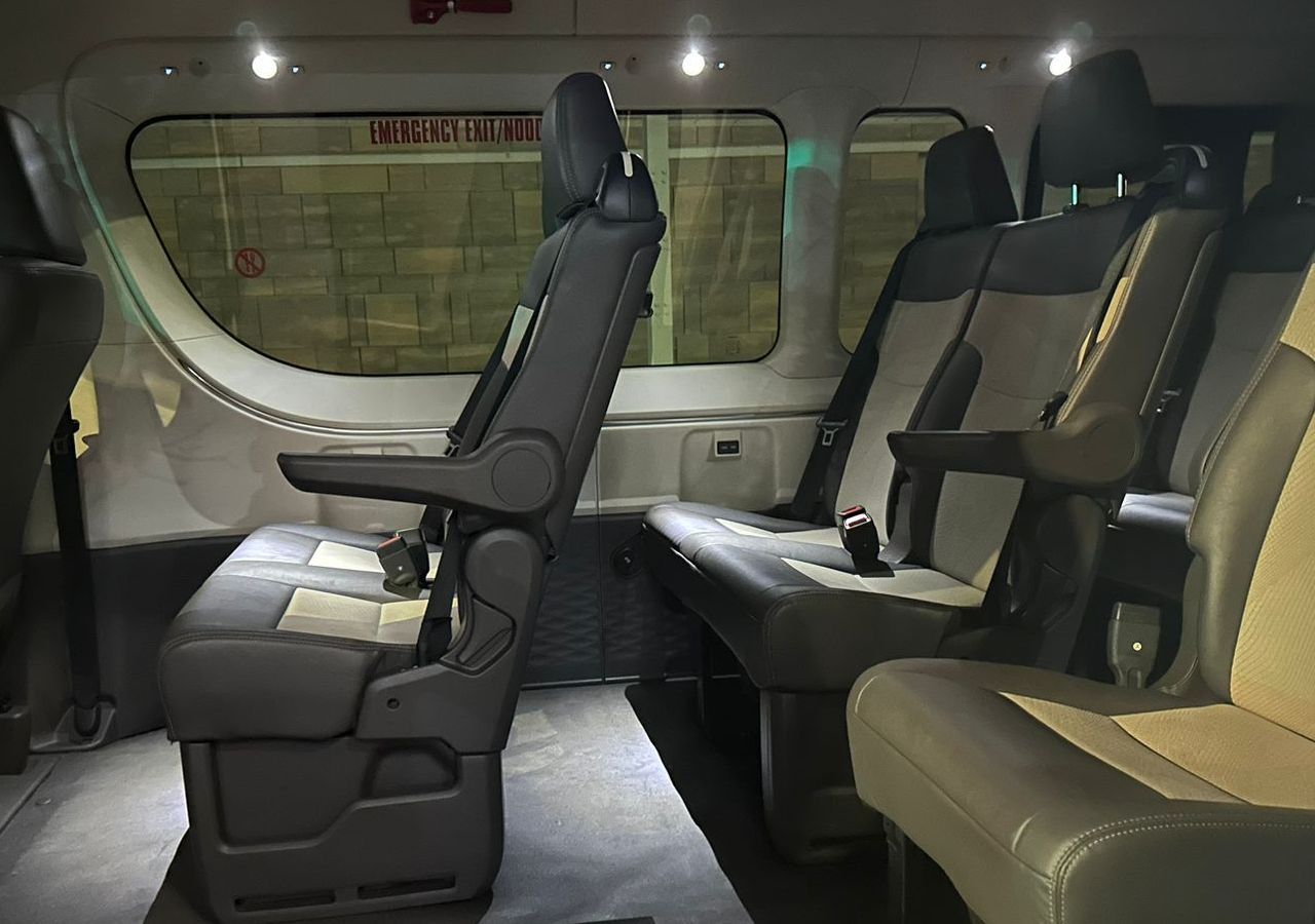 The inside of a van with a brick wall in the background