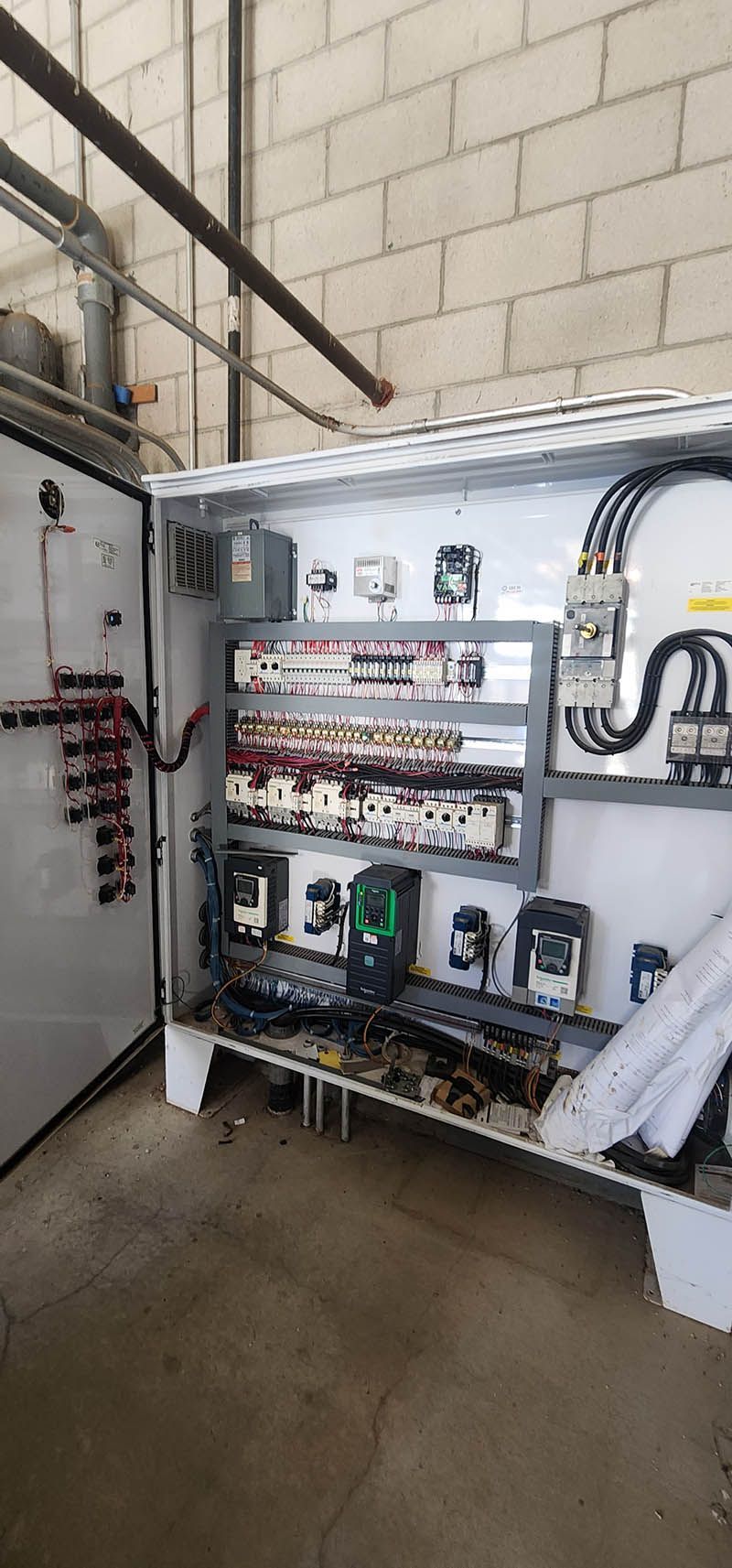 A large electrical box with a lot of wires coming out of it.