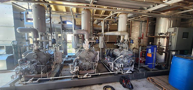 There are a lot of pipes and pumps in this room.