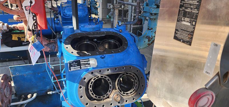 A blue machine is sitting on top of a table.