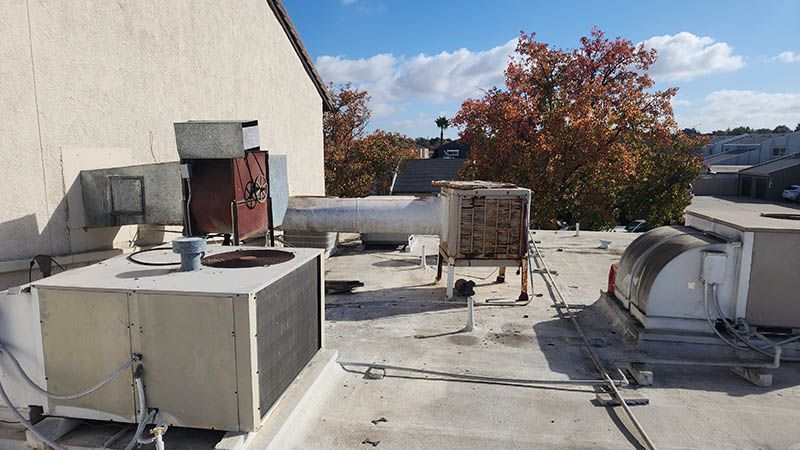 A rooftop with a lot of air conditioning equipment on it.