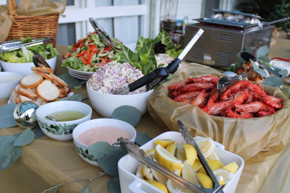 A Table Topped with Bowls of Food and Tongs — Every Occasion Catering in Currabubula, NSW