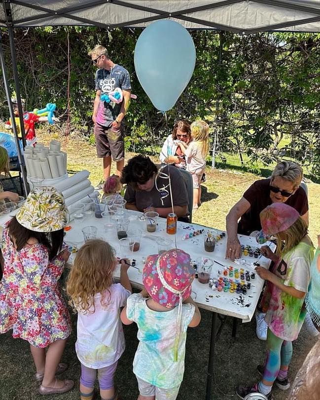 A Group of Children Are Sitting Around a Table Under a Tent — Every Occasion Catering in Quirindi, NSW