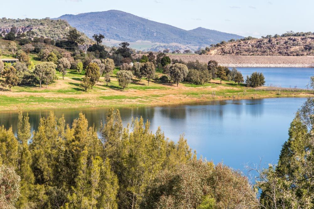 A Large Body of Water Surrounded by Trees and Mountains — Every Occasion Catering in Scone, NSW