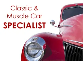 Classic and muscle car specialist with a red vintage car close-up