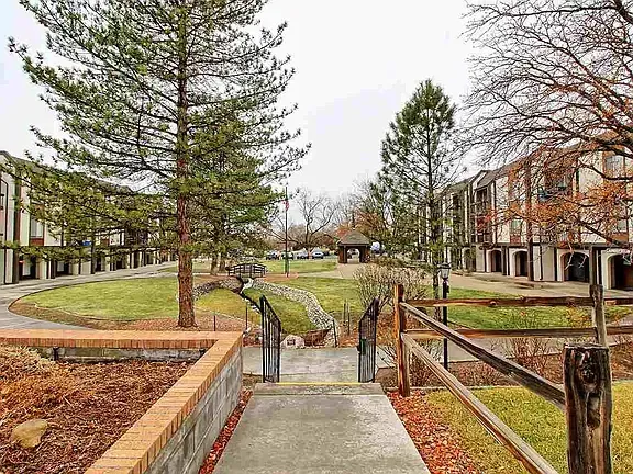 A large body of water with a tree in the foreground