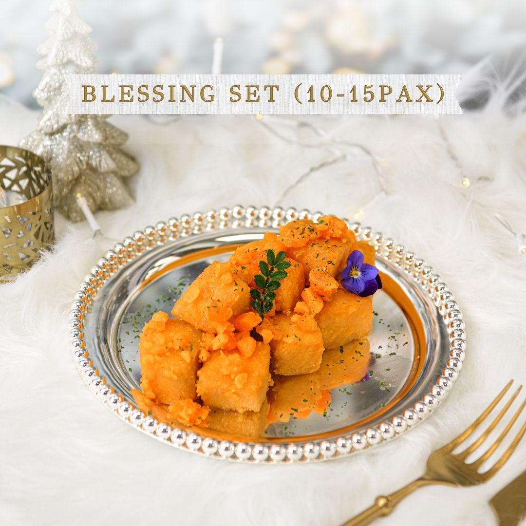 Silver platter with fried food, carrots, and a flower, part of a