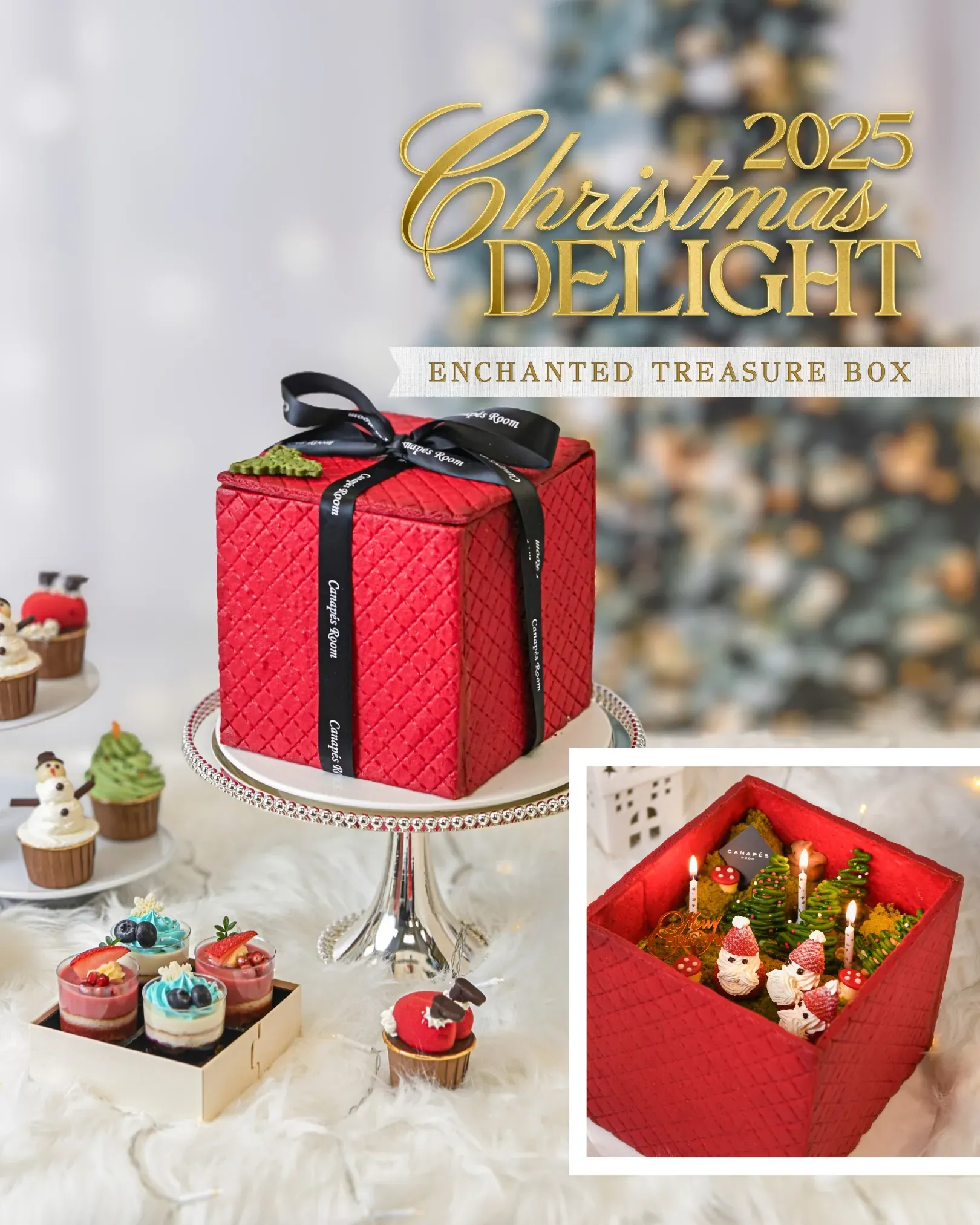 Red gift box cake with ribbon, cupcakes, and Christmas scene inside, on display.