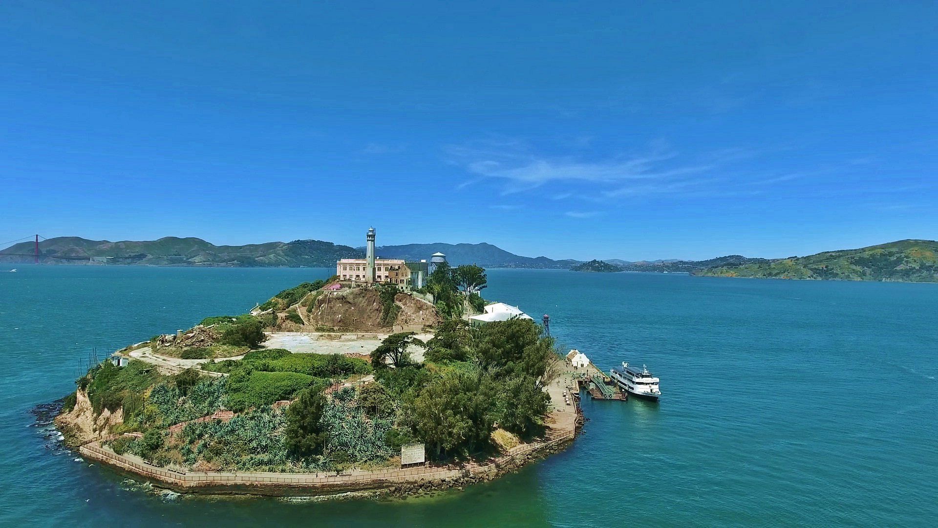 A small island in the middle of a body of water.